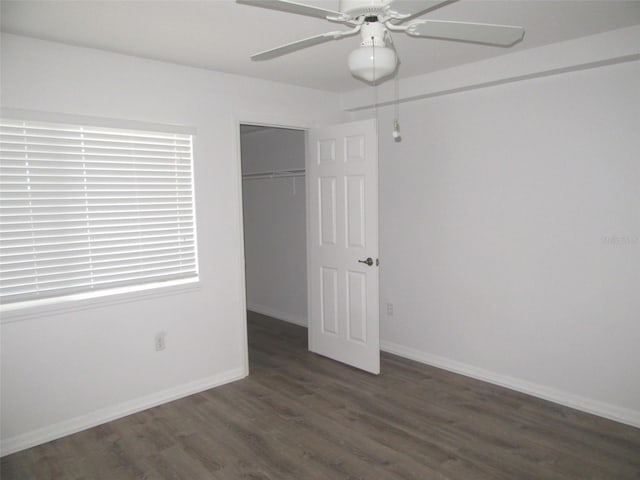 150 Harborside Ave Unit 124, Punta Gorda, FL 33950 - unfurnished bedroom featuring wood finished floors, a closet, baseboards, and ceiling fan