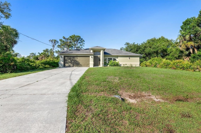 2381 Sheila Ln, North Port, FL 34286 - view of front facade with an attached garage, concrete driveway, a front lawn, and stucco siding