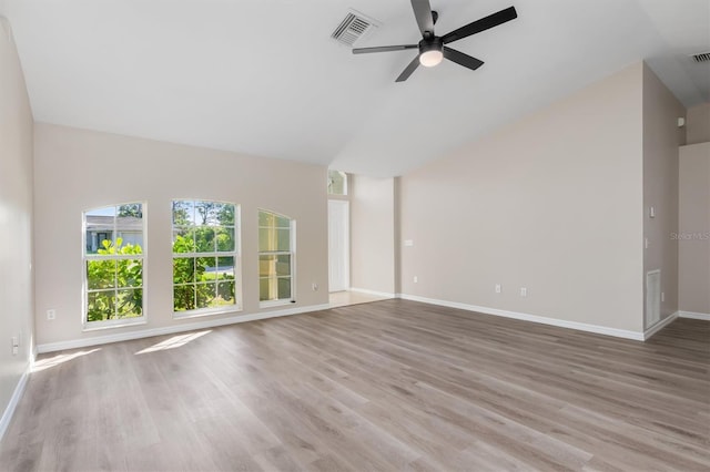 2381 Sheila Ln, North Port, FL 34286 - unfurnished room with a ceiling fan, baseboards, wood finished floors, and high vaulted ceiling