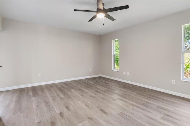 2381 Sheila Ln, North Port, FL 34286 - unfurnished room featuring baseboards, wood finished floors, and ceiling fan