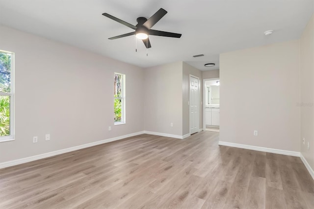 2381 Sheila Ln, North Port, FL 34286 - unfurnished room featuring baseboards, light wood-style floors, and a ceiling fan