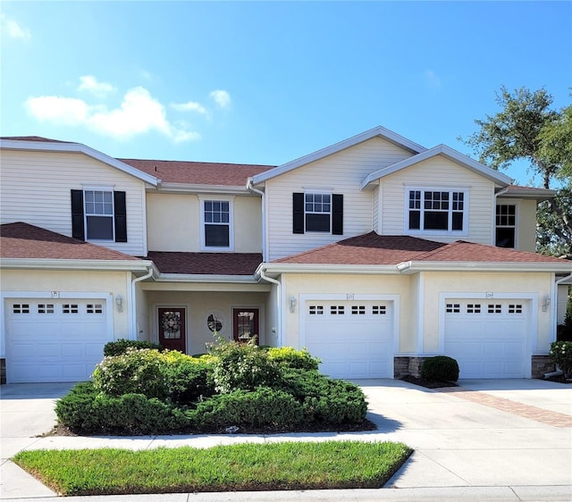 1271 Jonah Dr, North Port, FL 34289 - view of front of home featuring driveway, stucco siding, and a shingled roof