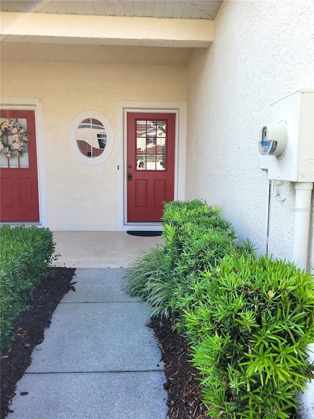 1271 Jonah Dr, North Port, FL 34289 - view of exterior entry with stucco siding