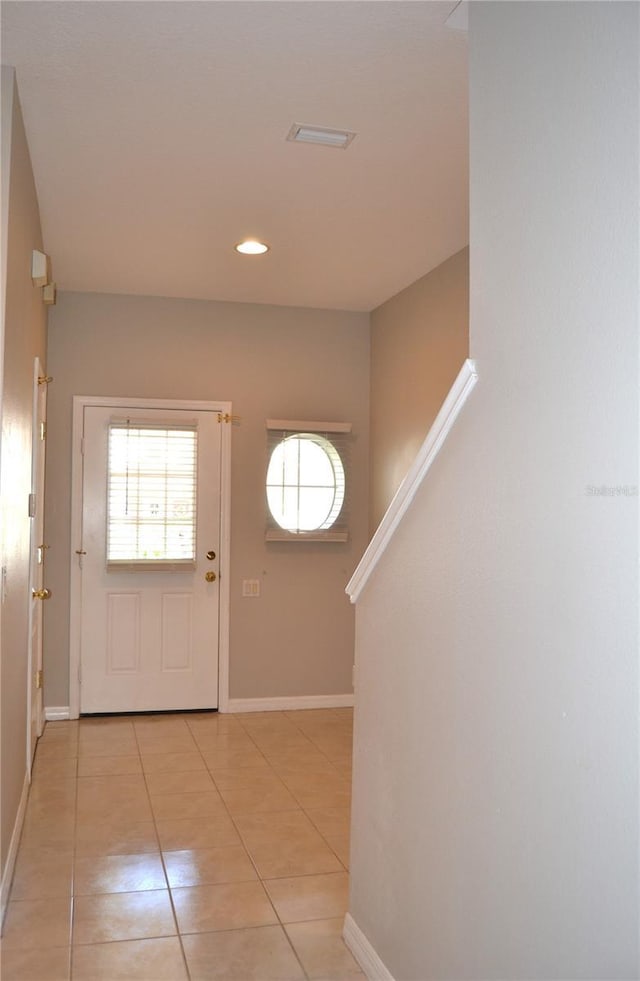 1271 Jonah Dr, North Port, FL 34289 - foyer with light tile patterned floors and recessed lighting