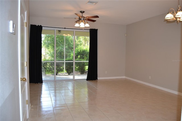 1271 Jonah Dr, North Port, FL 34289 - empty room featuring a chandelier, light tile patterned floors, and a ceiling fan