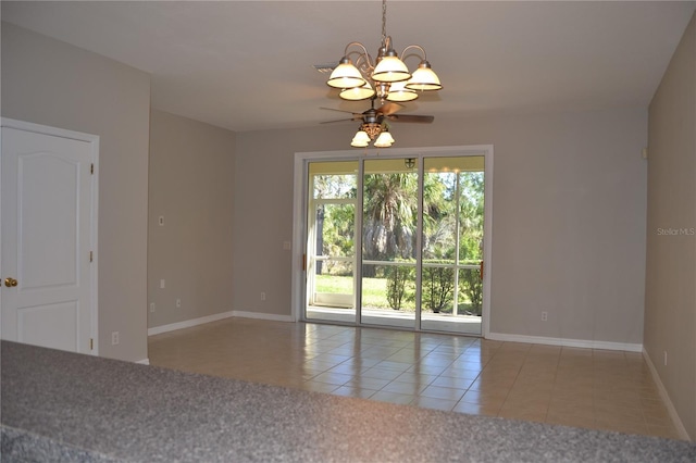 1271 Jonah Dr, North Port, FL 34289 - tiled spare room with ceiling fan and a chandelier