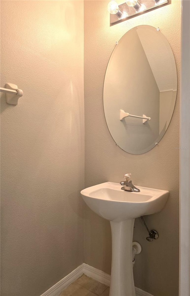 1271 Jonah Dr, North Port, FL 34289 - bathroom with tile patterned floors and baseboards