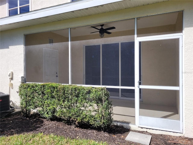 1271 Jonah Dr, North Port, FL 34289 - entrance to property featuring stucco siding and a ceiling fan