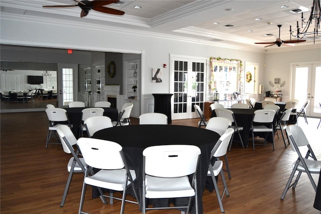 1271 Jonah Dr, North Port, FL 34289 - dining room featuring french doors, ceiling fan, ornamental molding, a raised ceiling, and wood finished floors
