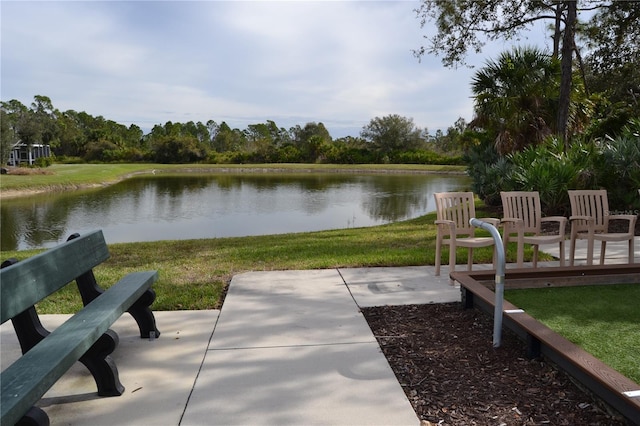 1271 Jonah Dr, North Port, FL 34289 - view of home's community featuring a water view, a lawn, and a patio area