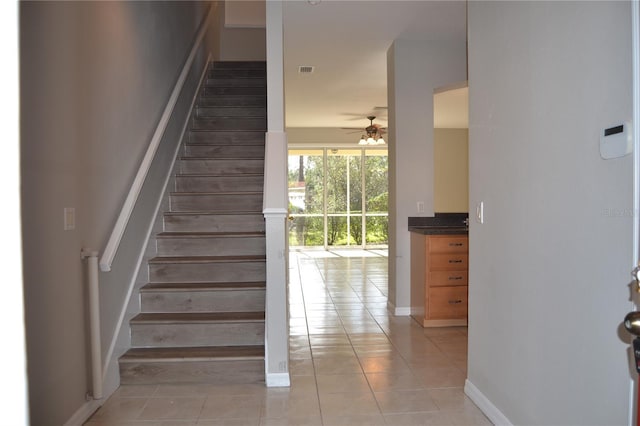 1271 Jonah Dr, North Port, FL 34289 - staircase with tile patterned flooring and ceiling fan