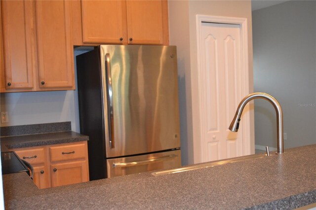 1271 Jonah Dr, North Port, FL 34289 - kitchen with freestanding refrigerator, dark countertops, and electric range