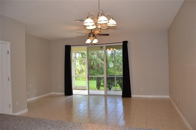 1271 Jonah Dr, North Port, FL 34289 - unfurnished room featuring light tile patterned floors, a ceiling fan, and a chandelier