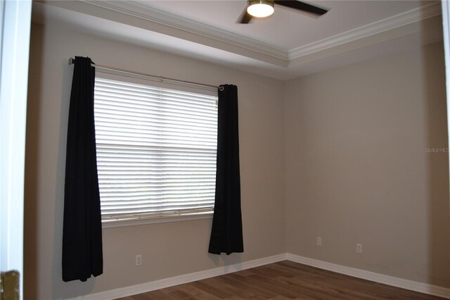1271 Jonah Dr, North Port, FL 34289 - empty room featuring wood finished floors, healthy amount of natural light, crown molding, and a ceiling fan
