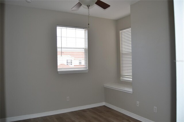 1271 Jonah Dr, North Port, FL 34289 - spare room featuring dark wood finished floors and ceiling fan