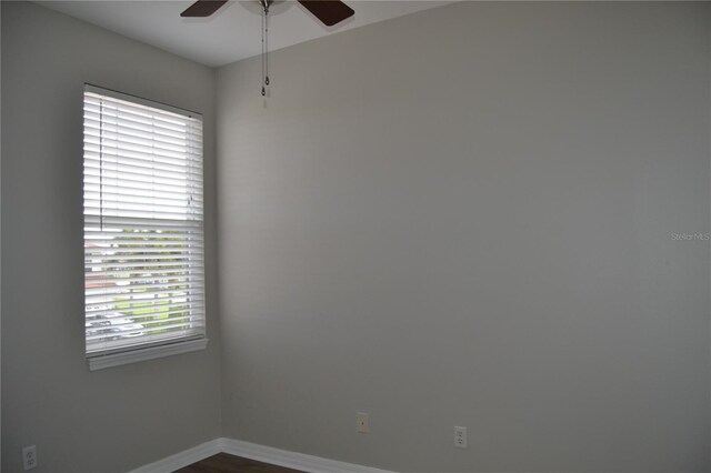 1271 Jonah Dr, North Port, FL 34289 - unfurnished room featuring ceiling fan and dark wood-style flooring