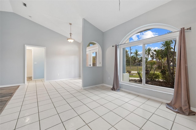 1 Sportsman Way, Rotonda West, FL 33947 - empty room with plenty of natural light, high vaulted ceiling, baseboards, and light tile patterned floors