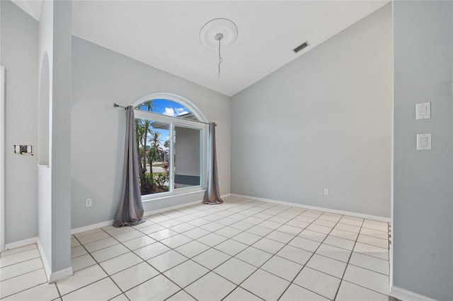 1 Sportsman Way, Rotonda West, FL 33947 - empty room with lofted ceiling, baseboards, and light tile patterned floors