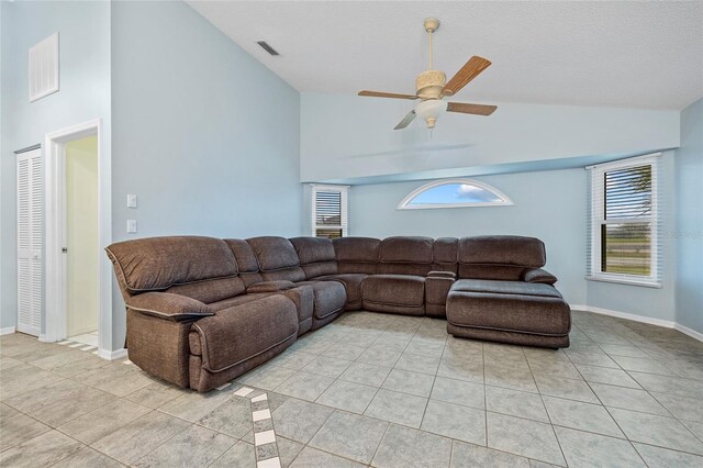 1 Sportsman Way, Rotonda West, FL 33947 - living room featuring light tile patterned floors, ceiling fan, high vaulted ceiling, and baseboards