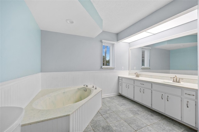 1 Sportsman Way, Rotonda West, FL 33947 - bathroom with a wainscoted wall, double vanity, and a garden tub