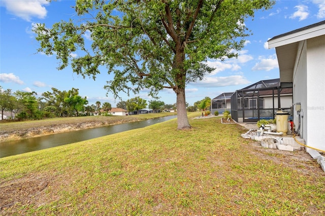 1 Sportsman Way, Rotonda West, FL 33947 - view of green lawn with a water view and a lanai