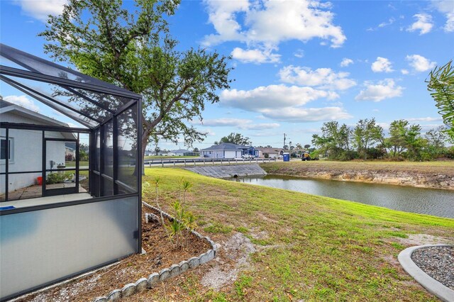 1 Sportsman Way, Rotonda West, FL 33947 - view of grassy yard with a water view and glass enclosure