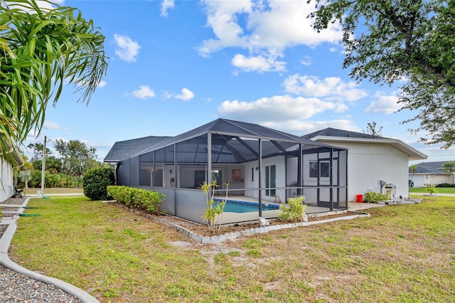 1 Sportsman Way, Rotonda West, FL 33947 - back of house featuring a yard, a lanai, stucco siding, and an outdoor pool