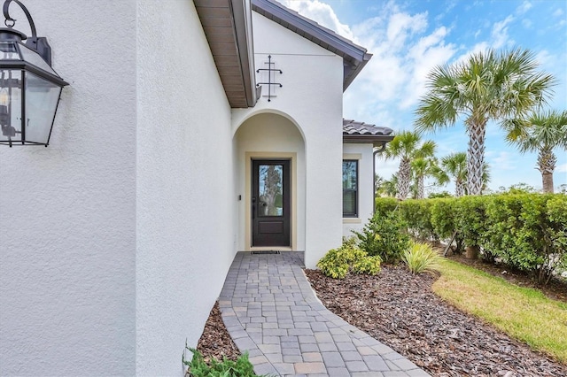 281 Potenza Loop, Nokomis, FL 34275 - view of exterior entry featuring stucco siding