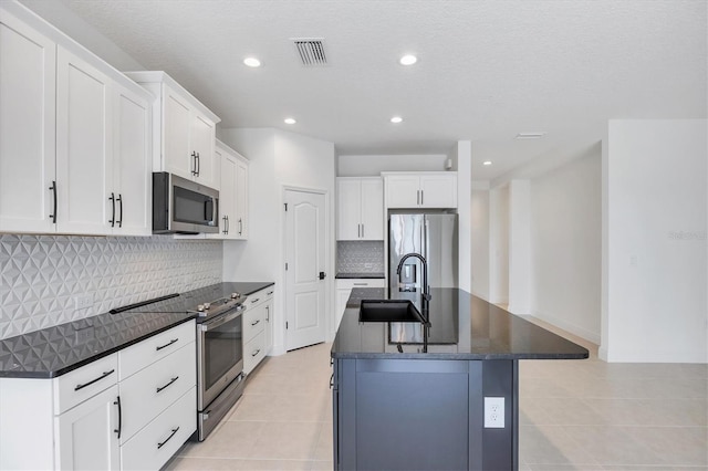 281 Potenza Loop, Nokomis, FL 34275 - kitchen featuring stainless steel appliances, a sink, light tile patterned flooring, tasteful backsplash, and recessed lighting