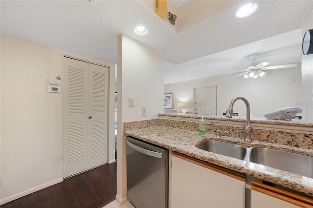 19505 Quesada Ave Unit M104, Port Charlotte, FL 33948 - kitchen featuring dishwasher, a sink, ceiling fan, light stone counters, and light wood-style floors