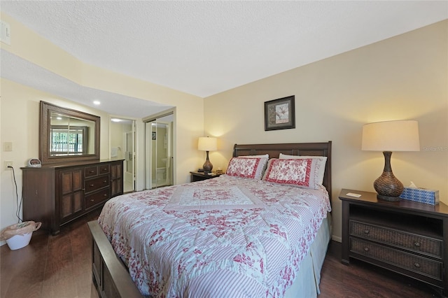 19505 Quesada Ave Unit M104, Port Charlotte, FL 33948 - bedroom featuring wood finished floors and ensuite bathroom