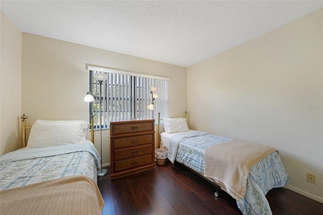 19505 Quesada Ave Unit M104, Port Charlotte, FL 33948 - bedroom with dark wood-style flooring and baseboards