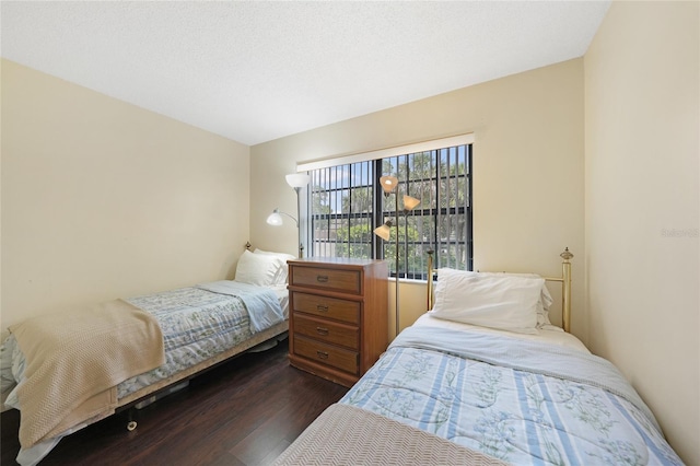 19505 Quesada Ave Unit M104, Port Charlotte, FL 33948 - bedroom featuring dark wood-type flooring