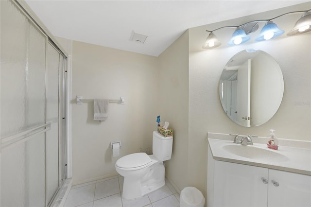 19505 Quesada Ave Unit M104, Port Charlotte, FL 33948 - full bathroom with tile patterned flooring, a stall shower, toilet, vanity, and baseboards