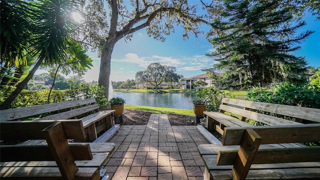 19505 Quesada Ave Unit M104, Port Charlotte, FL 33948 - view of patio / terrace with a water view