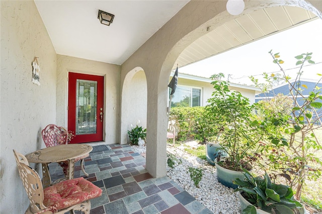 2008 Pellam Blvd, Port Charlotte, FL 33948 - property entrance with stucco siding and a patio