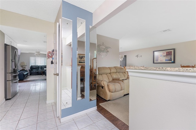 2008 Pellam Blvd, Port Charlotte, FL 33948 - hallway featuring light tile patterned floors and baseboards