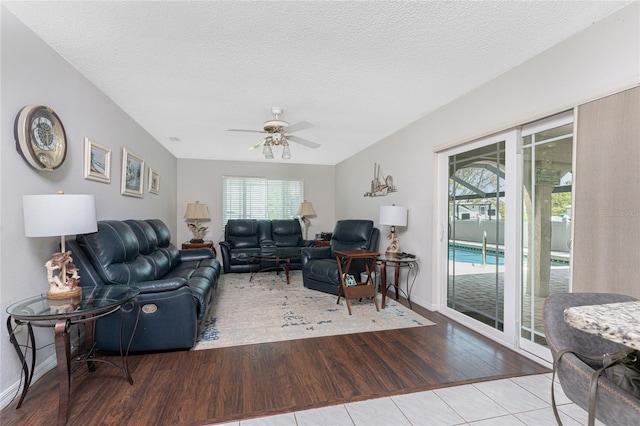 2008 Pellam Blvd, Port Charlotte, FL 33948 - living area featuring ceiling fan, wood finished floors, a textured ceiling, and baseboards