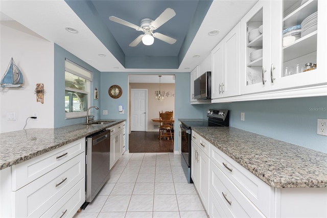 2008 Pellam Blvd, Port Charlotte, FL 33948 - kitchen featuring appliances with stainless steel finishes, a sink, light stone counters, a ceiling fan, and recessed lighting