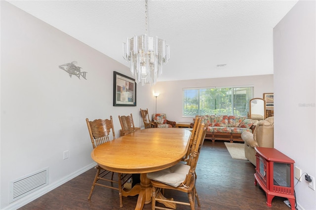 2008 Pellam Blvd, Port Charlotte, FL 33948 - dining area with a chandelier, wood finished floors, baseboards, and a textured ceiling