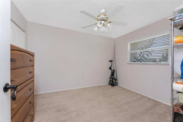 2008 Pellam Blvd, Port Charlotte, FL 33948 - unfurnished bedroom featuring light colored carpet, ceiling fan, a textured ceiling, and baseboards