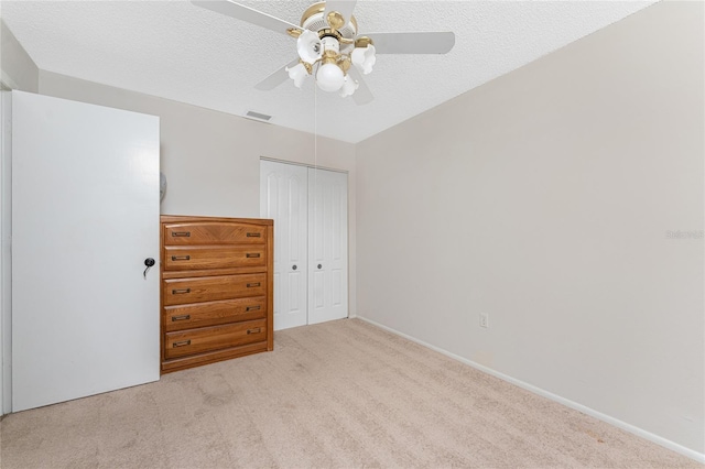 2008 Pellam Blvd, Port Charlotte, FL 33948 - bedroom with a closet, carpet floors, ceiling fan, baseboards, and a textured ceiling