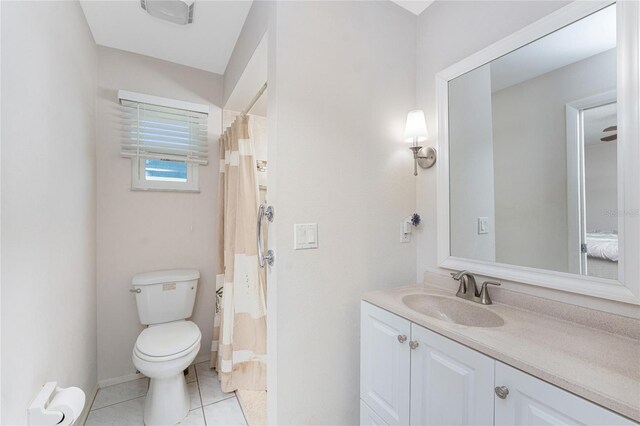2008 Pellam Blvd, Port Charlotte, FL 33948 - bathroom featuring toilet, tile patterned floors, vanity, and curtained shower