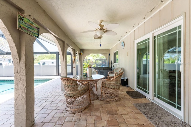 2008 Pellam Blvd, Port Charlotte, FL 33948 - view of patio / terrace with a ceiling fan, an outdoor pool, a lanai, and outdoor dining space