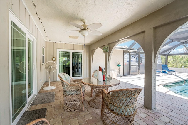 2008 Pellam Blvd, Port Charlotte, FL 33948 - view of patio / terrace featuring a ceiling fan, a lanai, an outdoor pool, and outdoor dining area