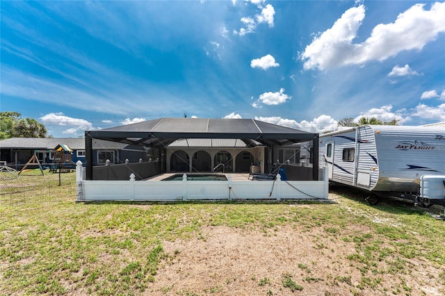 2008 Pellam Blvd, Port Charlotte, FL 33948 - rear view of property with glass enclosure