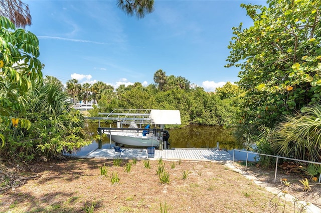 2008 Pellam Blvd, Port Charlotte, FL 33948 - view of yard featuring a boat dock and boat lift
