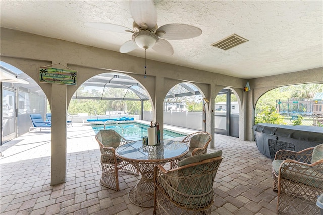 2008 Pellam Blvd, Port Charlotte, FL 33948 - view of patio / terrace featuring a ceiling fan, glass enclosure, and fence