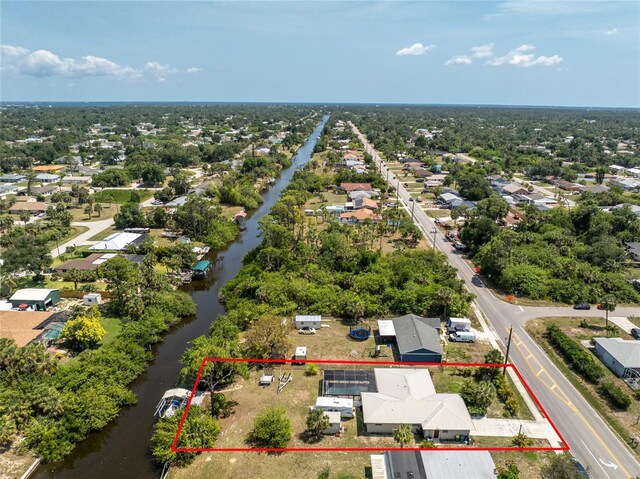 2008 Pellam Blvd, Port Charlotte, FL 33948 - aerial perspective of suburban area with property boundaries highlighted and a large body of water