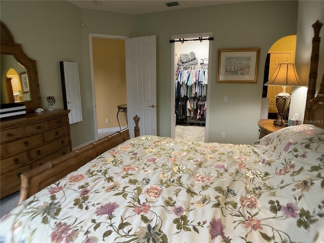 1961 Palo Duro Blvd, North Fort Myers, FL 33917 - bedroom with a spacious closet, a closet, and arched walkways